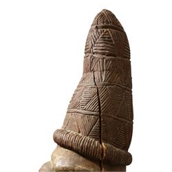 African tribal maternity figure of a woman with children, probably Yoruba, carved wood, the woman stood upon a craved mask, H133cm