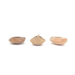 Antiquities; two decorative terracotta Byzantine oil lamps, 4th - 5th century, with decora...