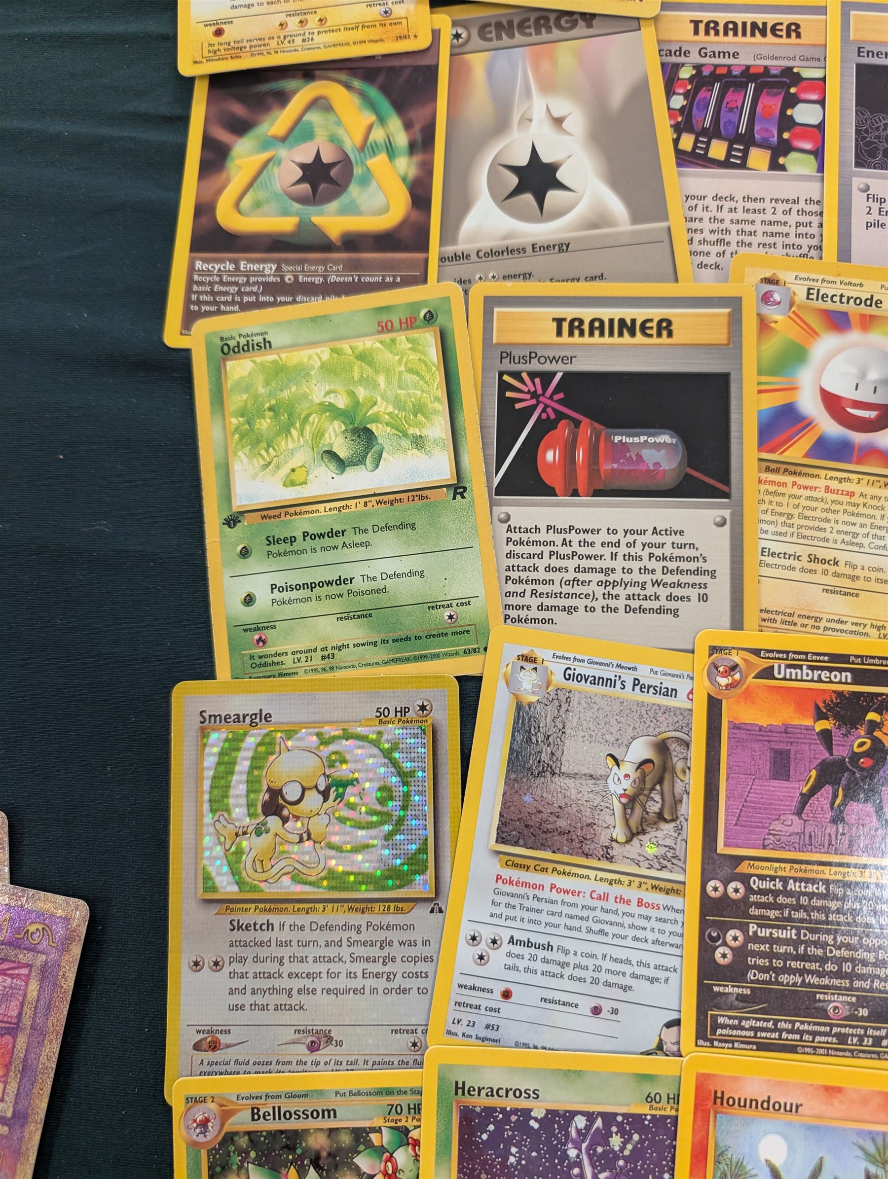 Collection of Pokemon TGC trading cards, including two WB First Movie Black Star promo cards Pikachu no. 4 and Dragonite no. 5, two Ancient Mew Black Star holo promo cards, Gym Challenge Giovanni's Persian 8/132 holo and a small collection WOTC, Neo Discovery and Neo Genesis cards, together with thirty four Bandai Carddass Pokemon cards, including prism Charizard no. 186 and Pokemon Topps cards including holo examples 