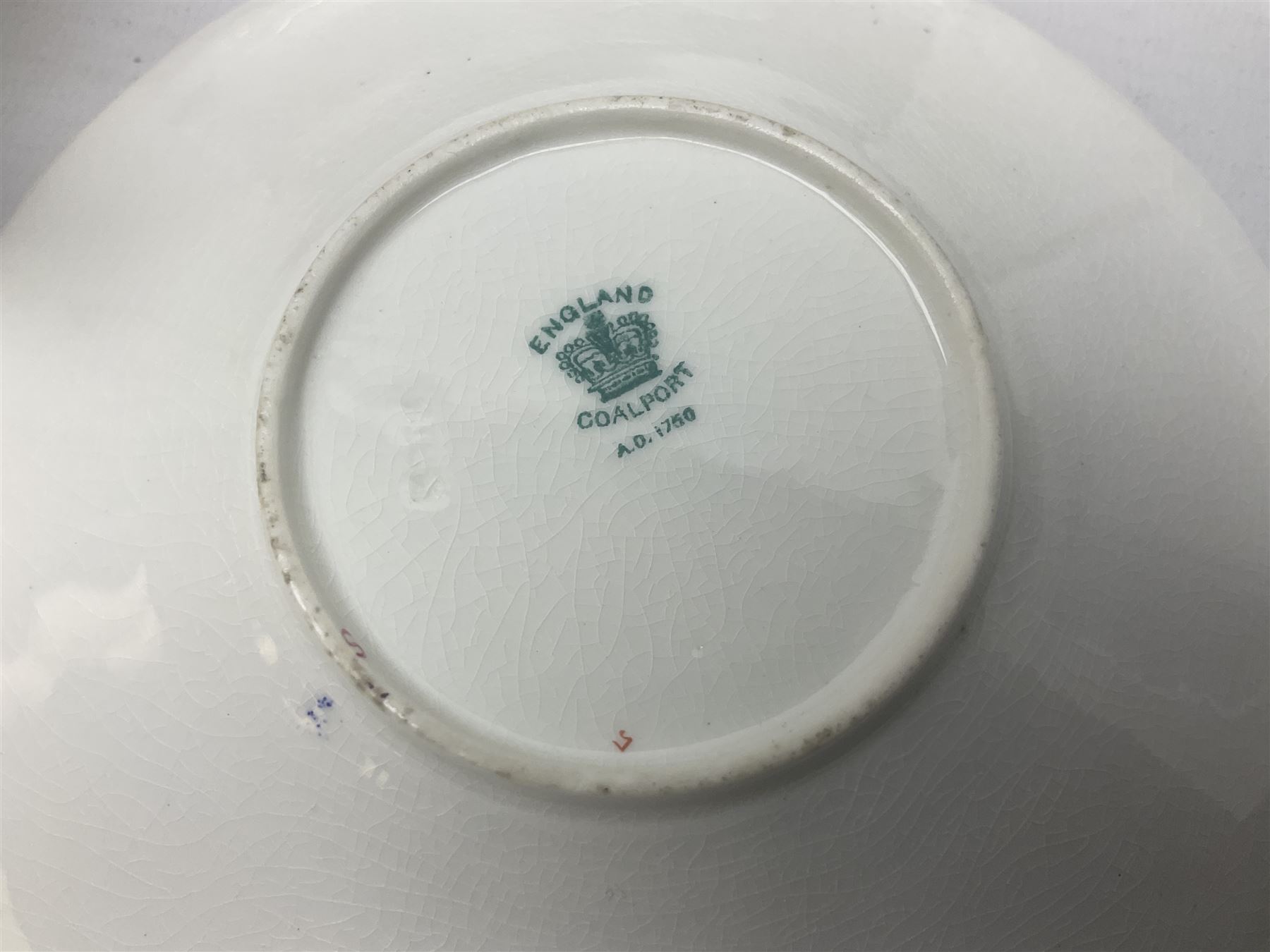 Coalport cobalt blue batwing pattern tea wares, decorated with finely enamelled floral sprays within gilt reserves, comprising teacup trio, coffee can and saucer and other cup and saucer, twin handled cake plate, milk jug and open sucrier, and circular plate retailed by T. Goode & Co London, pattern no Y2665,  all with green Coalport AD 1750 marks beneath, largest W26cm (11)