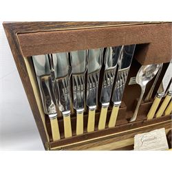 Twelve place setting canteen of cutlery by Lee & Wigfull Ltd, cased in an oak  chest, with key, meat carvers are missing, H18cm, L44cm 
