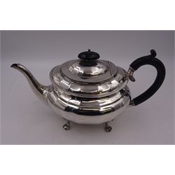1920s silver teapot, of oval faceted form, with Bakelite type handle and finial, with presentation engraving to body, and upon four paw feet, hallmarked Northern Goldsmiths Co, Birmingham 1929, H16cm