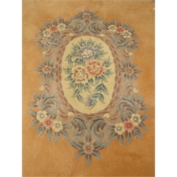  Chinese pink ground woollen rug, central floral medallion, 276cm x 184cm  