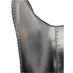 Metal framed butterfly chair upholstered in slung dark tan stitched leather 
