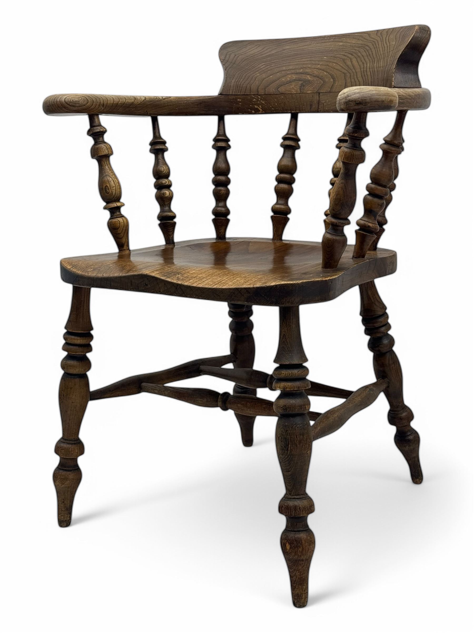 19th century elm and beech smoker's bow armchair, shaped arms over turned spindle gallery and dished seat, on turned supports united by double H-shaped swell turned stretchers 