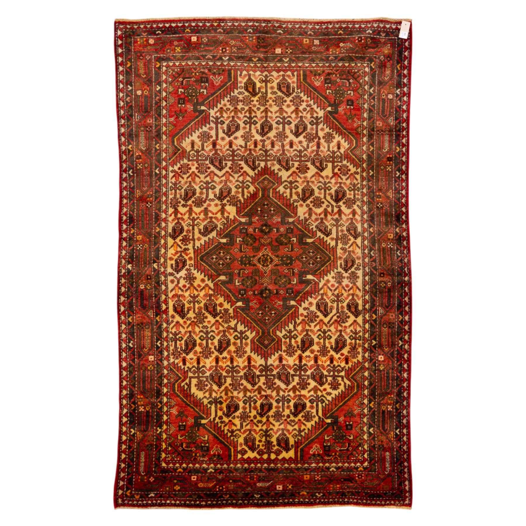 North West Persian Malayer hand-knotted rug, ivory field with central stepped lozenge medallion with angular pendants, surrounded by rows of stylized boteh and geometric floral devices within multiple geometric and stylized vine borders, with fringe ends