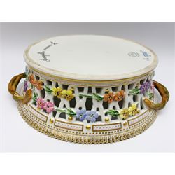 Royal Copenhagen Flora Danica basket, with naturalistically modelled vine handles and reticulated sides detailed with polychrome forget-me-nots, the interior decorated with a botanical study of 'Anagallis arvensis', sprigs and a gilt border, with printed and painted marks beneath, H8cm L26cm 

