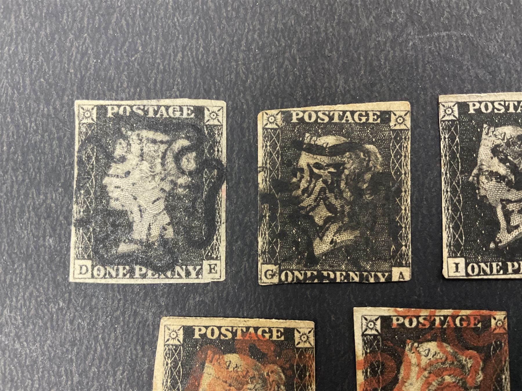 Seven Great Britain Queen Victoria penny black stamps, three with black and four with red MX cancels