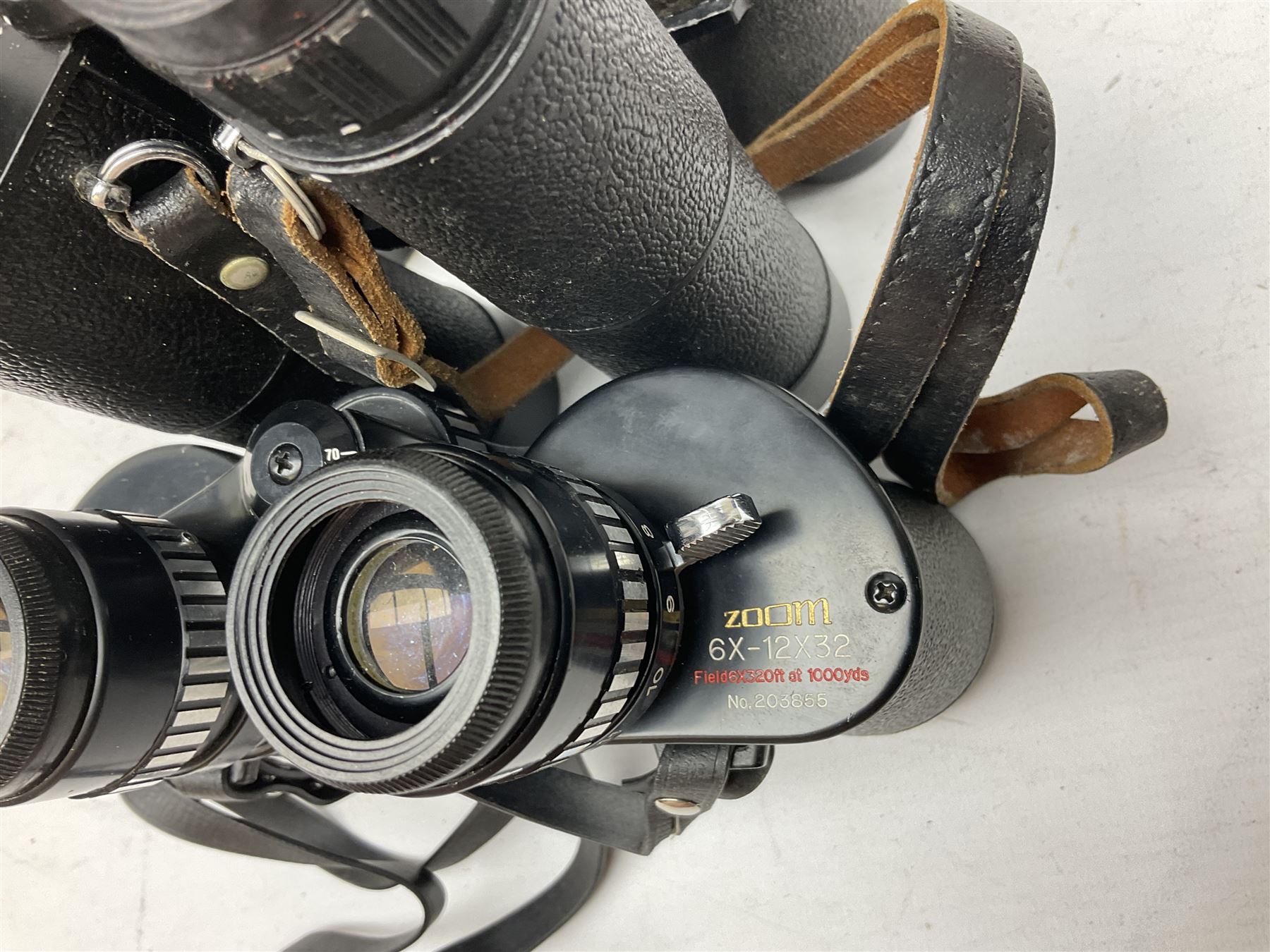 Eleven cased pairs of binoculars to include Summit 8x30,  Concord 8x40, Tasco no. 106 8x - 16x40, Chinon 10x50, Tokina 7x42 Field, Zoom 6x- 12x32 etc