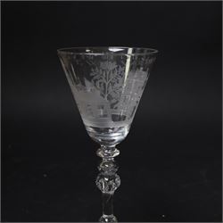 Dutch engraved Newcastle light baluster glass, circa 1760, the funnel bowl engraved with a two storey country house and church flanked by trees, beneath the inscription ‘T WELVAREN VAN LANDT ENKERK’ (The prosperity of the Country and Church), upon a multi knopped stem with beaded knop and basal knop, over conical foot, H18cm



