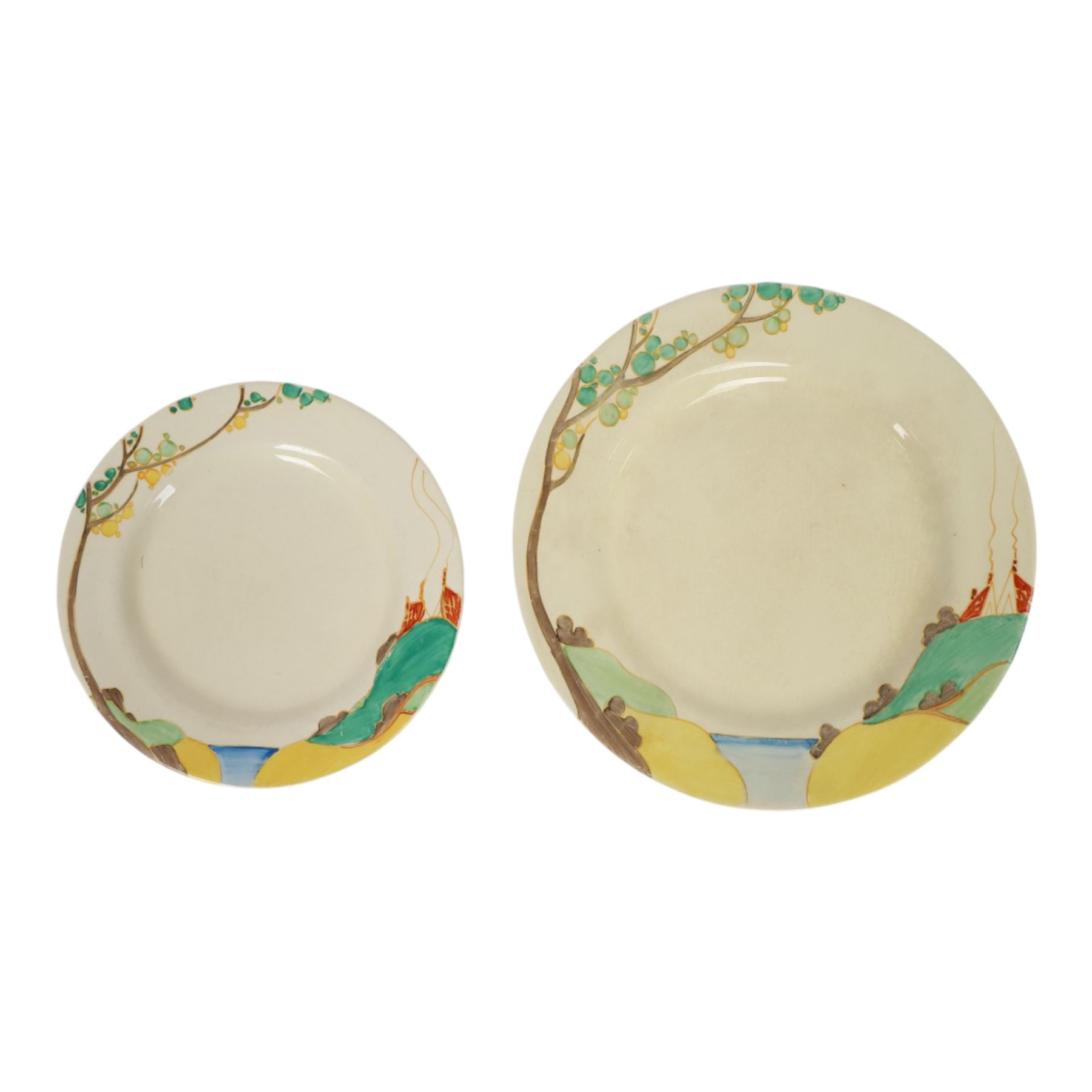 Clarice Cliff Secrets pattern plates, circa 1933, hand painted with a shoulder variant of a tree and cottage landscape, with Bizarre and printed marks to base, D23cm and D18cm