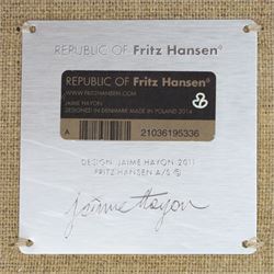 Fritz Hansen - 'Favn' sofa, designed by Jaime Hayon (1974-), upholstered in light grey fabric, the organic curved back and integrated arms enclosing loose seat and back cushions, raised on slender cylindrical metal supports