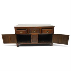 18th century oak dresser base, rectangular top over three drawers, fitted with twin panelled hutch-cupboard doors flanking central fielded panel, raised on stile supports