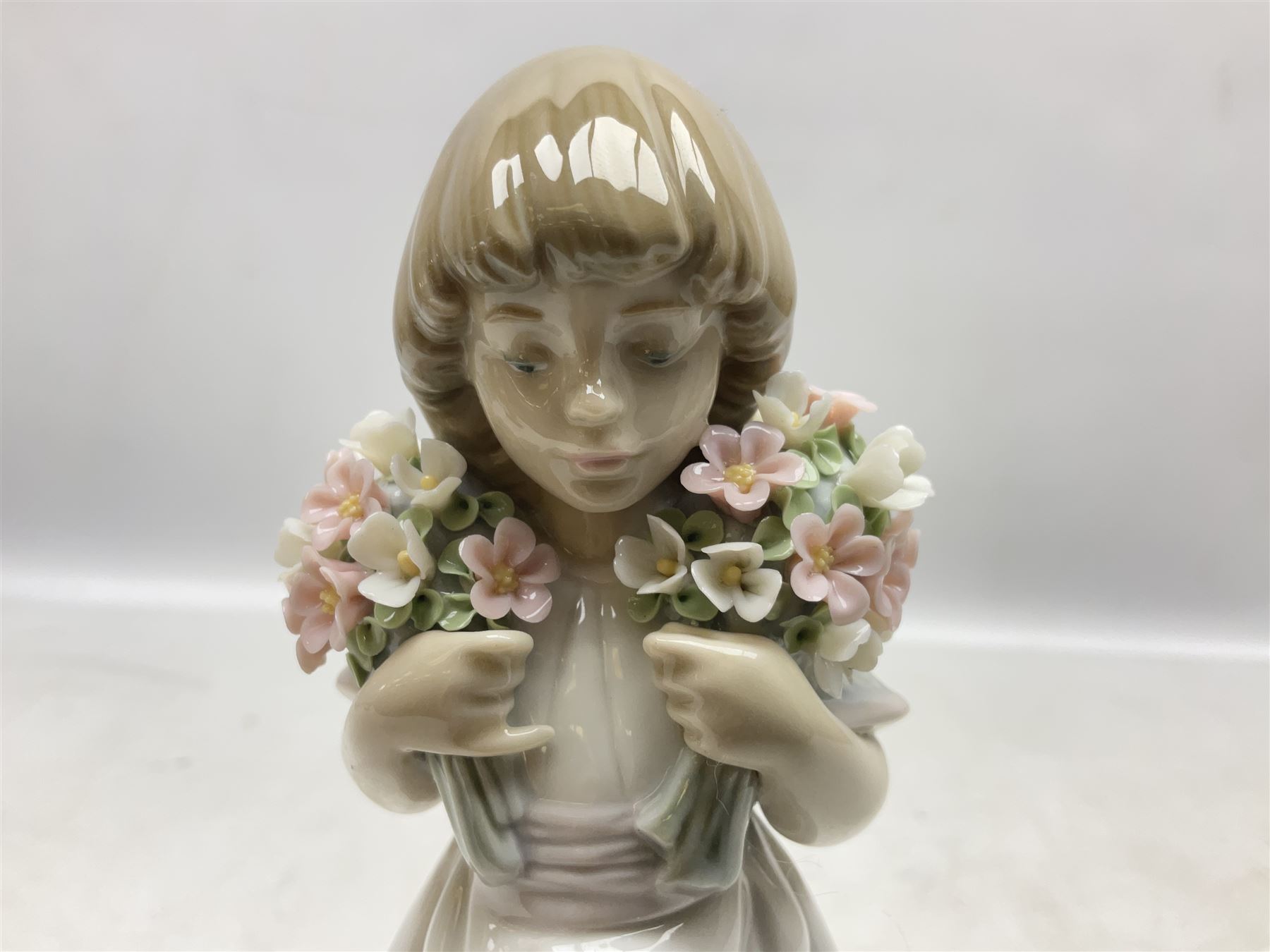 Three Lladro figures comprising, Pocket Full of Wishes no 7650, School Days no 7604 and Spring Bouquets no 7603, all with original boxes, largest example H26cm  