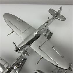 Set of three aluminium planes with rotating propellers, tallest H18cm