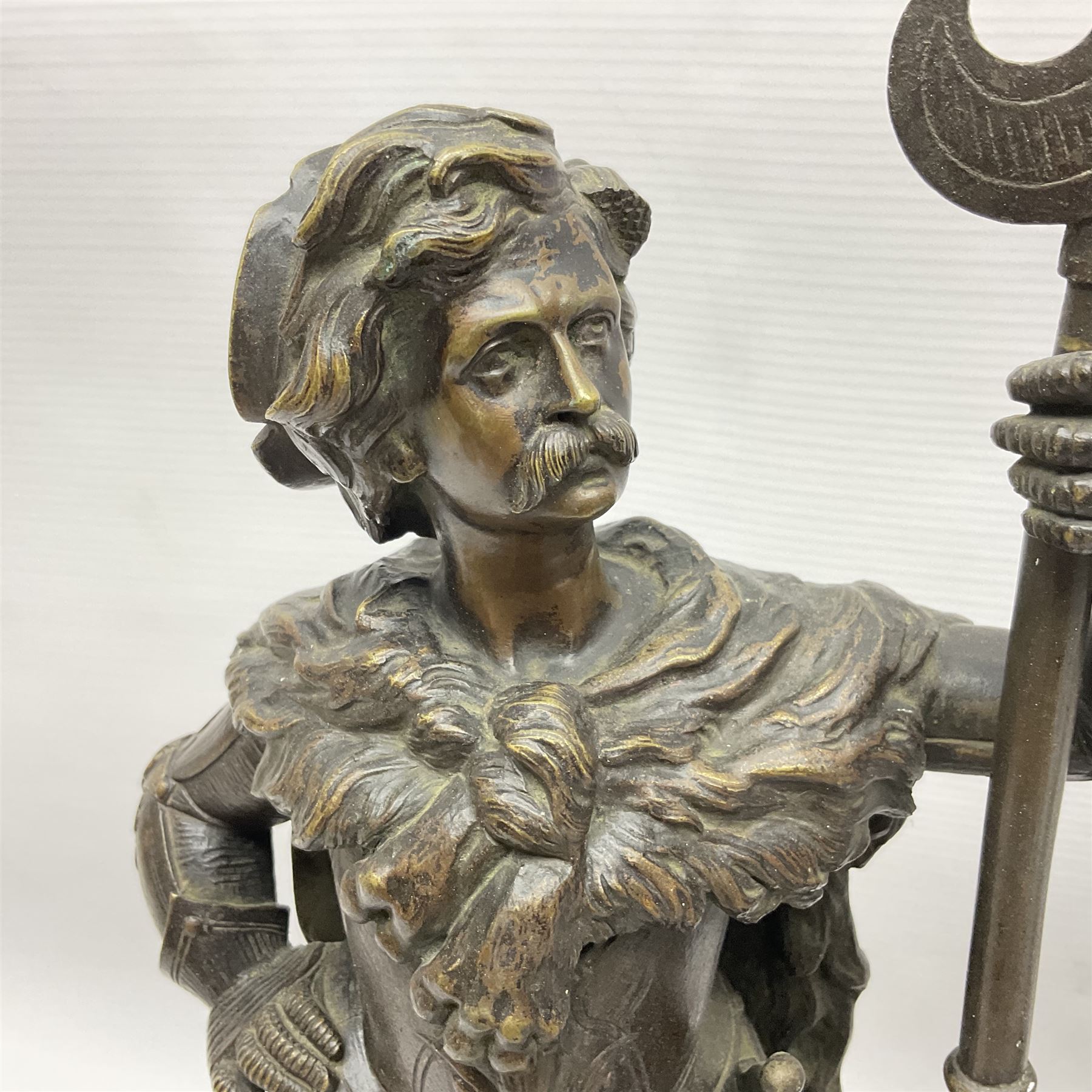 Pair of bronzed figure modelled as a hunter in traditional dress, each holding a pike, H48cm