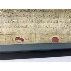 Two mid 18th century indentures of local interest, the first dated 1786 relating to the Garbut family, the second dated 1759, both with wax seals and in glazed frames, W66cm H47cm
