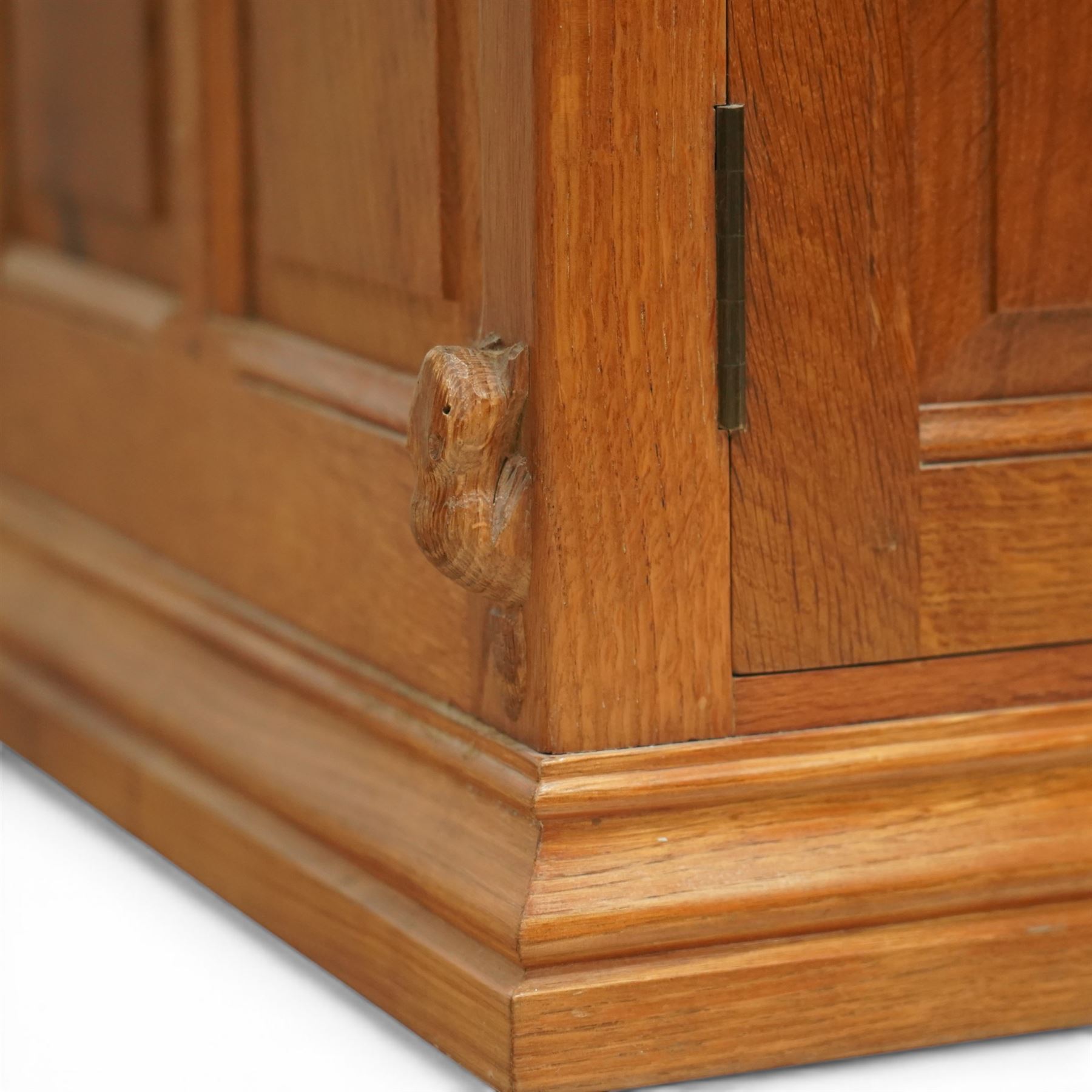  Beaverman - oak media cabinet, rectangular top with interictally carved panels to the side and front doors, twin doors with Yorkshire Rose carved wooden knob, enclosing a staggered shelf arrangement above two drawers, raised on a moulded plinth base, with carved beaver signature, by Colin Almack of Sutton near Thirsk