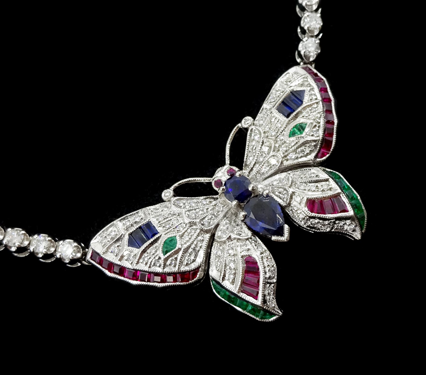White gold butterfly necklace, the diamond, sapphire, ruby and emerald set butterfly, suspending from a round brilliant cut diamond necklace, stamped 14K, diamond weight approx 6.20 carat