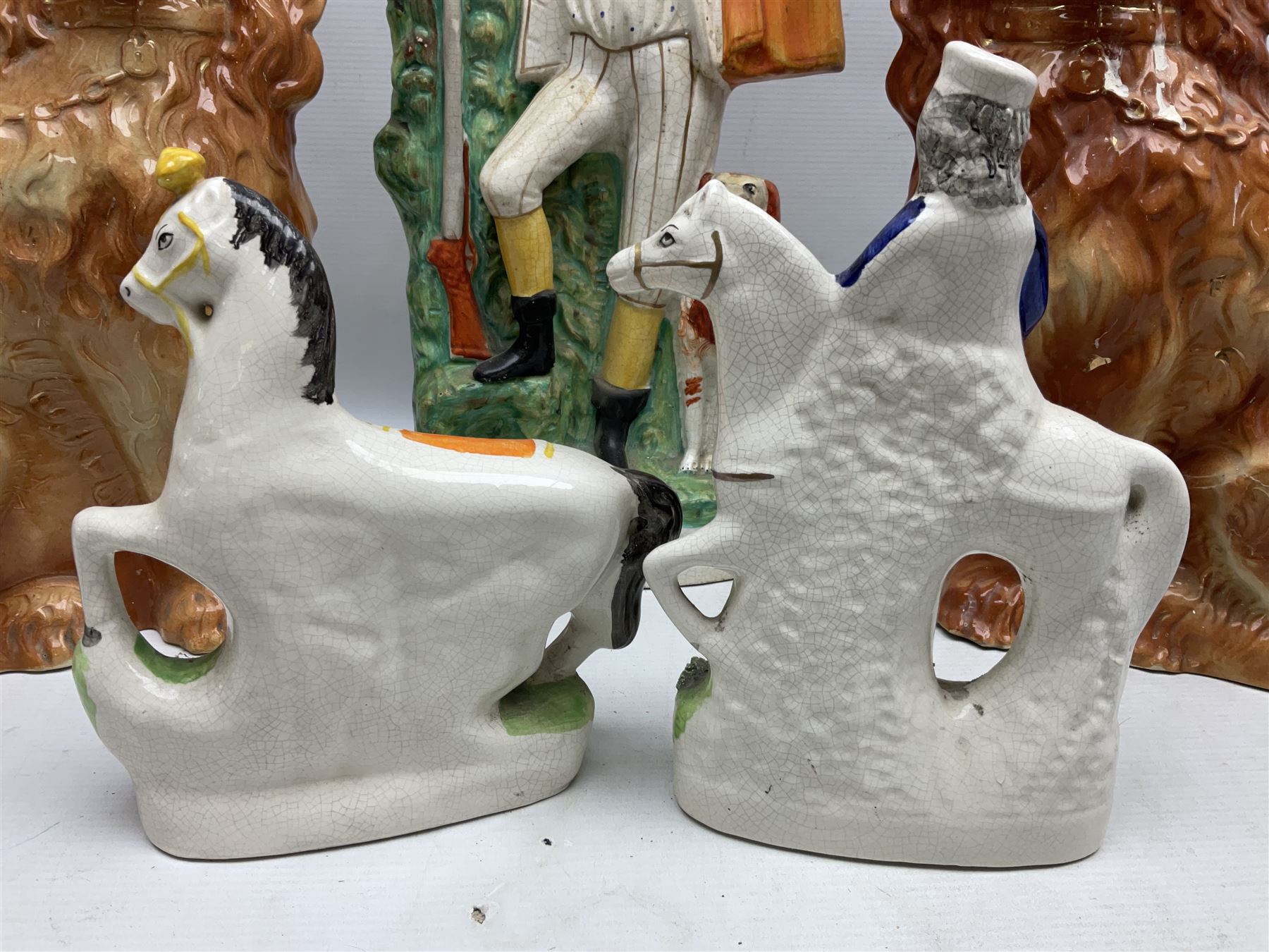 Group of Victorian and later Staffordshire style figures, to include two dogs, Prince upon horse back, horse with pink lustre patches, tall figure of a man beside his dog etc, tallest H41cm