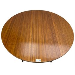 Mid-20th century circa. 1960s teak dining table, circular top on splayed supports