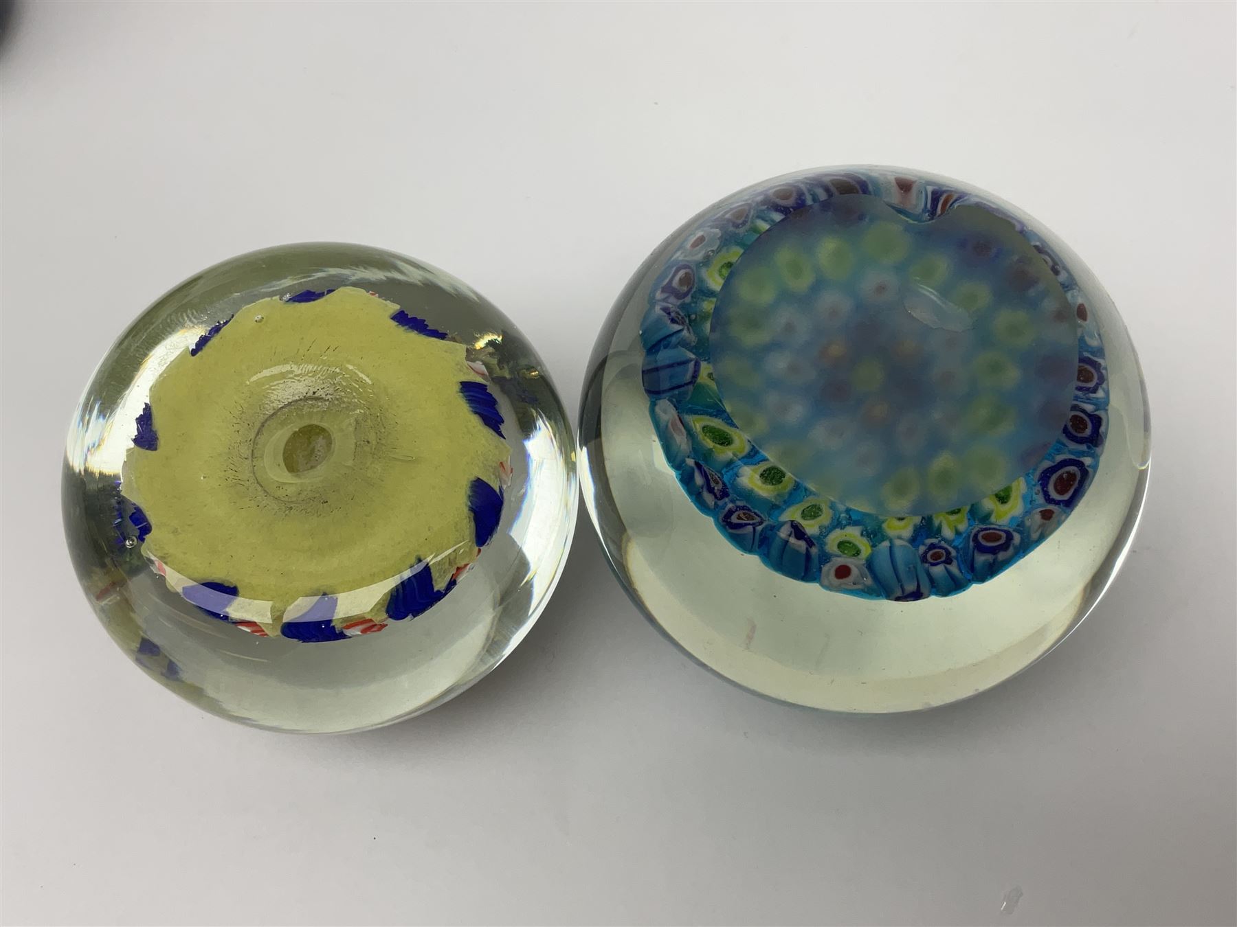 John Ditchfield for Glassform iridescent glass paperweight, together with two millefiori paperweights and one other 