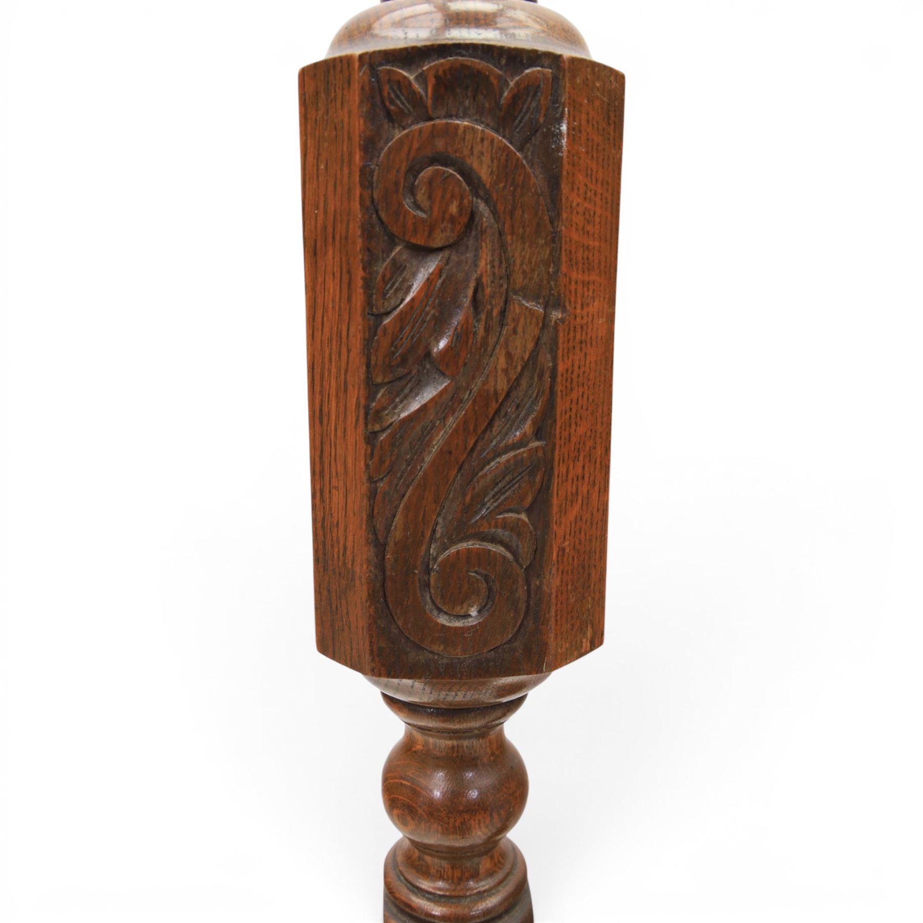 Late Victorian set of two oak standard lamps, turned and carved column supports, one with foliate carved panelled stem, on stepped square bases with carved scroll feet, the other on circular moulded spreading base