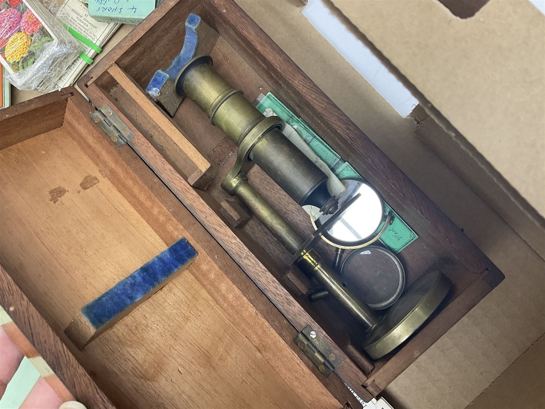 Floral tapestry in a mahogany frame, large collection of cigarette cards, framed tapestry, small microscope and a wooden correspondence box, frame H66cm