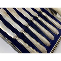 Set of six silver handled butter knives, in case, pair of silver handled fish servers, two silver handled shoe horns, and two silver handled button hooks, all hallmarked or stamped Sterling