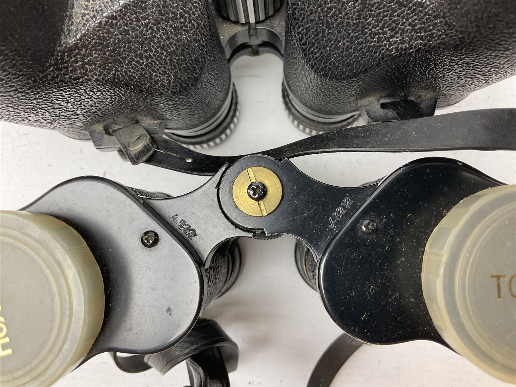 Twelve pairs of binoculars to include BWCF 7x35 Extra Wide Angle, Carl Zeiss Jena Delturis 8x24, Carl Zeiss Jena Jenoptem 8x30W, Chinon Countryman 10x50,  Ajax 8x30, Regent 16x50, etc,  some with cases