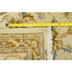 Modern Pakistani Oushak style hand-knotted runner,  ivory field with an all-over scrolling floral vine design incorporating stylized palmettes and rosettes in soft tones of pale blue, sage green and muted gold, enclosed by conforming border, cotton fringe ends 