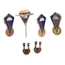 Collection of East German army parachutist metal insignia

