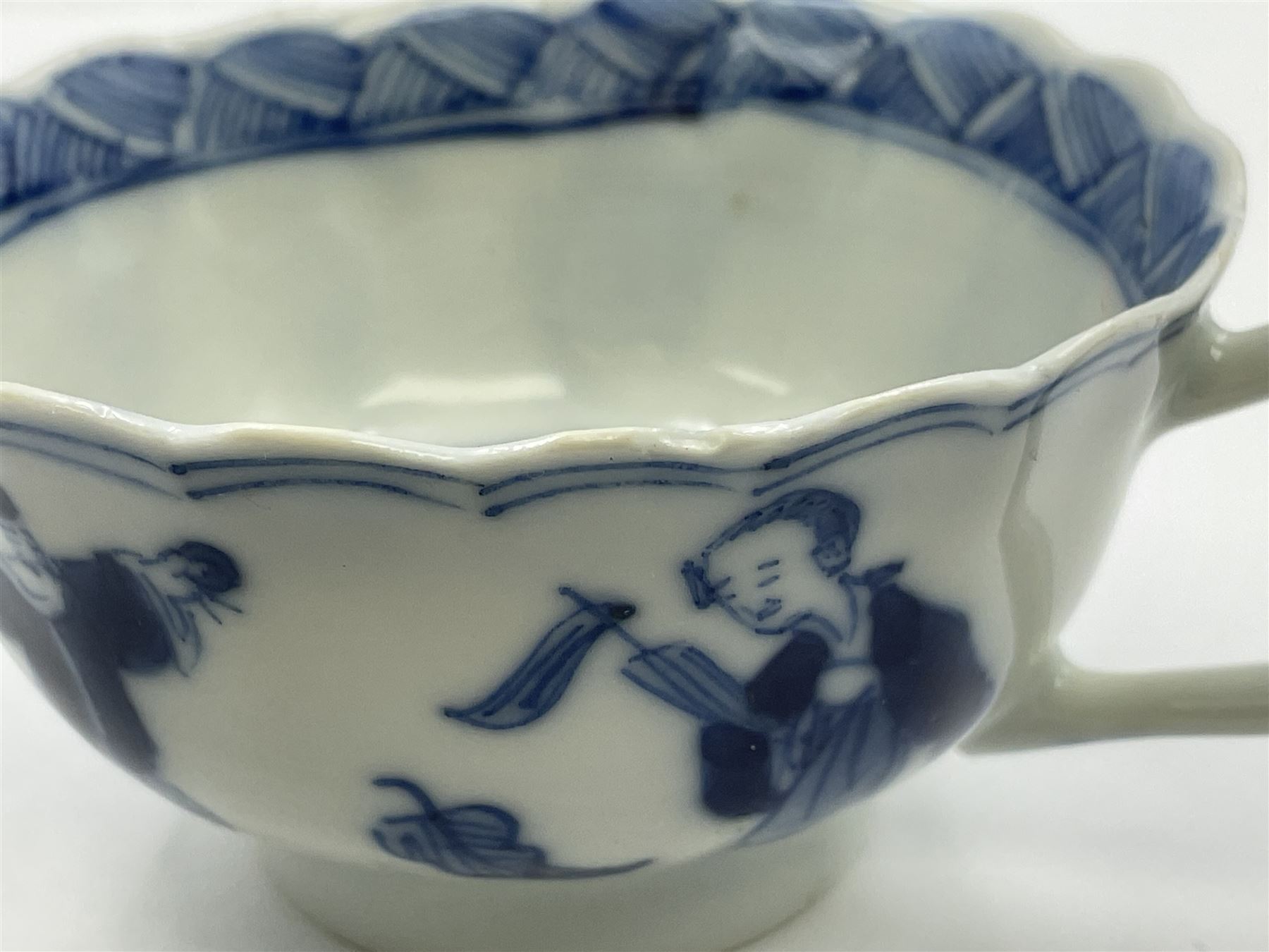 18th century Chinese blue and white Kangxi teacup and saucer, decorated with dancing figures, four character Kangxi mark beneath, saucer D10cm