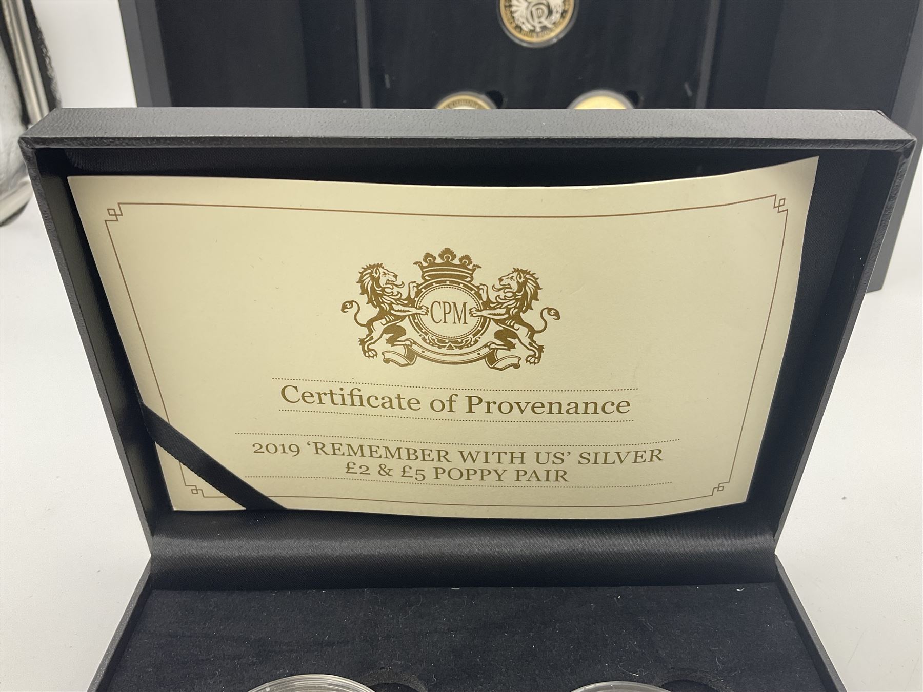 King Charles III 2023 'Coronation Silver Proof Mint Masters Set' comprising Bailiwick of Jersey, Bailiwick of Guernsey and Isle of Man sterling silver proof five pound coins, cased with certificate and Queen Elizabeth II 2019 Bailiwick of Jersey 'Remember With Us' silver two pound and five pound pair, cased with CPM certificate