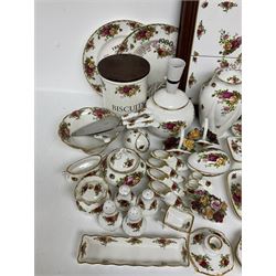 Royal Albert Old Country Roses pattern ceramics, to include table lamp, lidded vase, two pairs of salt and pepper shakers, cups and saucers, plates, biscuit jar, bowls, lidded preserve pot, vases, dishes, knives, napkin rings, lidded jars and box, pair of candlesticks etc