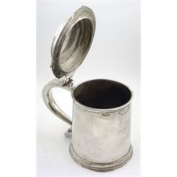 Queen Anne silver tankard, of plain tapering cylindrical form, with stepped and flat-domed cover, twit cast thumbpiece and curved handle, the body engraved with eagle crest, hallmarked Abraham Barachin, Hull, circa 1706, the body and cover stamped once with makers mark and twice with town mark, H18cm, approximate weight 21.46 ozt (667.7 grams)
