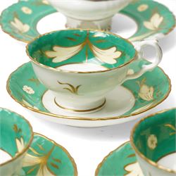 19th century porcelain tea service decorated with a border pattern of yellow leaves on a green ground comprising twelve cups and saucers, tea pot, sucrier and cover, milk jug, slop bowl and three plates, pattern number 5850