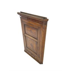 George III oak and mahogany banded wall hanging corner cupboard, reeded cornice over panelled door with inlaid detail enclosing three shelves with shaped fronts, fitted with three small crossbanded drawers to base
