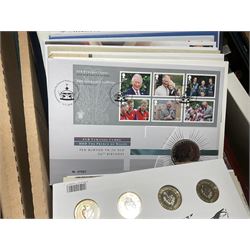 Approximately one hundred and fifteen Royal Mint coin covers, in two ring binder folders and loose, together with approximately 53 grams of Great British pre-1920 and approximately 68 grams of Great British pre-1947 silver threepence coins, and a small quantity of further pre-decimal coins