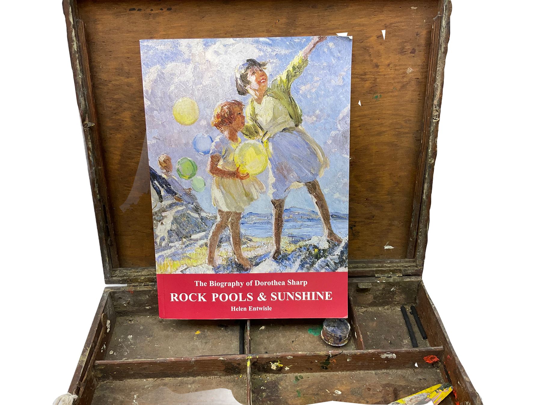 Dorothea Sharp ROI RBA (1874-1955): 20th century mahogany artist's box from Sharp's London studio, including contents: brushes and pallet knives, together with a studio palette, The Biography of Dorothea Sharp, Rock Pools & Sunshine by Helen Entwisle, and copies of two letters relating to the acquisition of the artist's box.

Provenance: Acquired alongside the purchase of other items from Sharp's Studio from Mr & Mrs Mills by Biographer Helen Entwisle in 1994). Later purchased by the current vendor along with other items from Entwisle who currently lives in Knaresborough. (Part sold at Lanes in Cornwall). 
