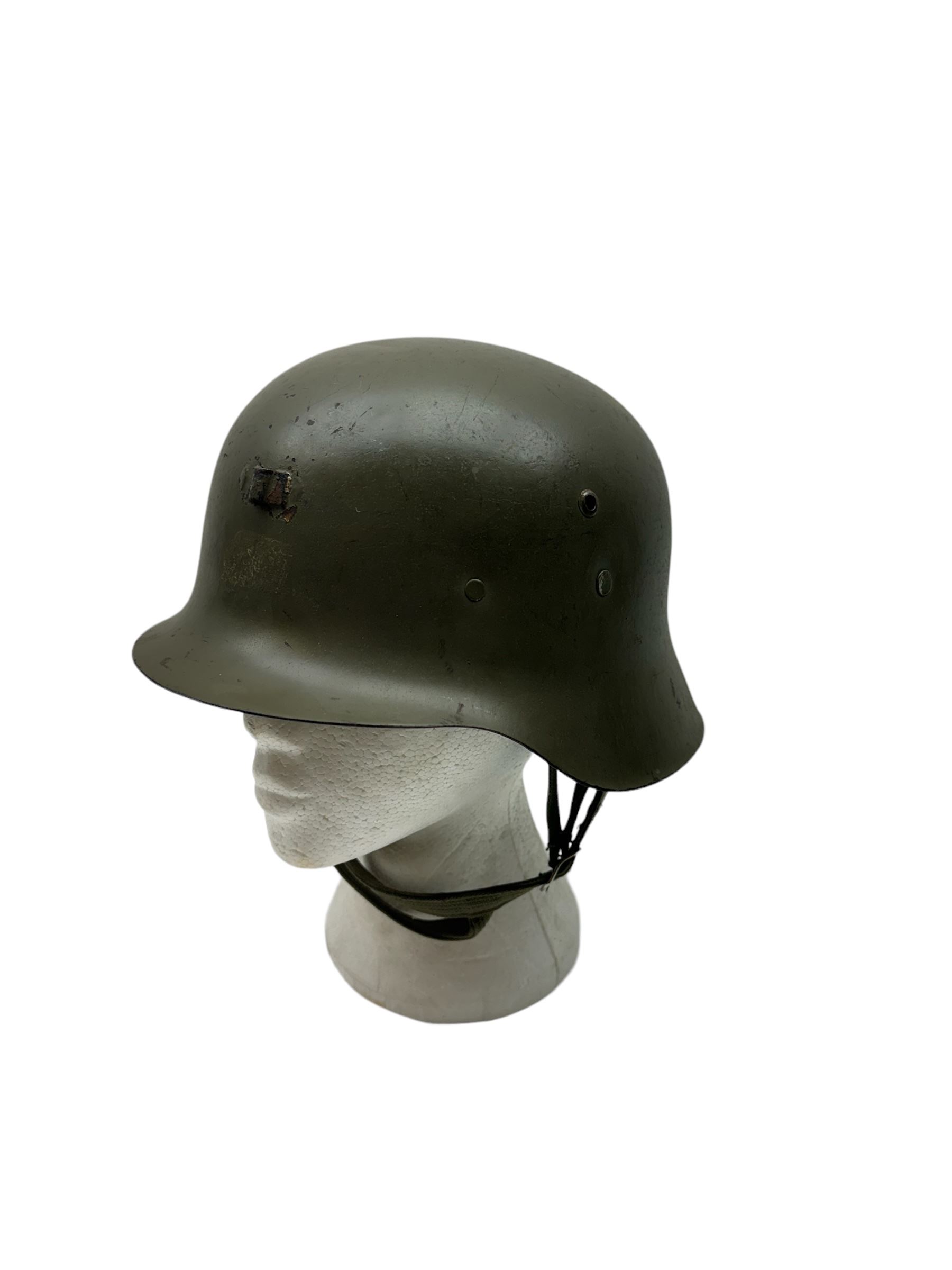 WWII Spanish combat steel helmet model Z, with leather lining and canvas strap, interior D22cm 