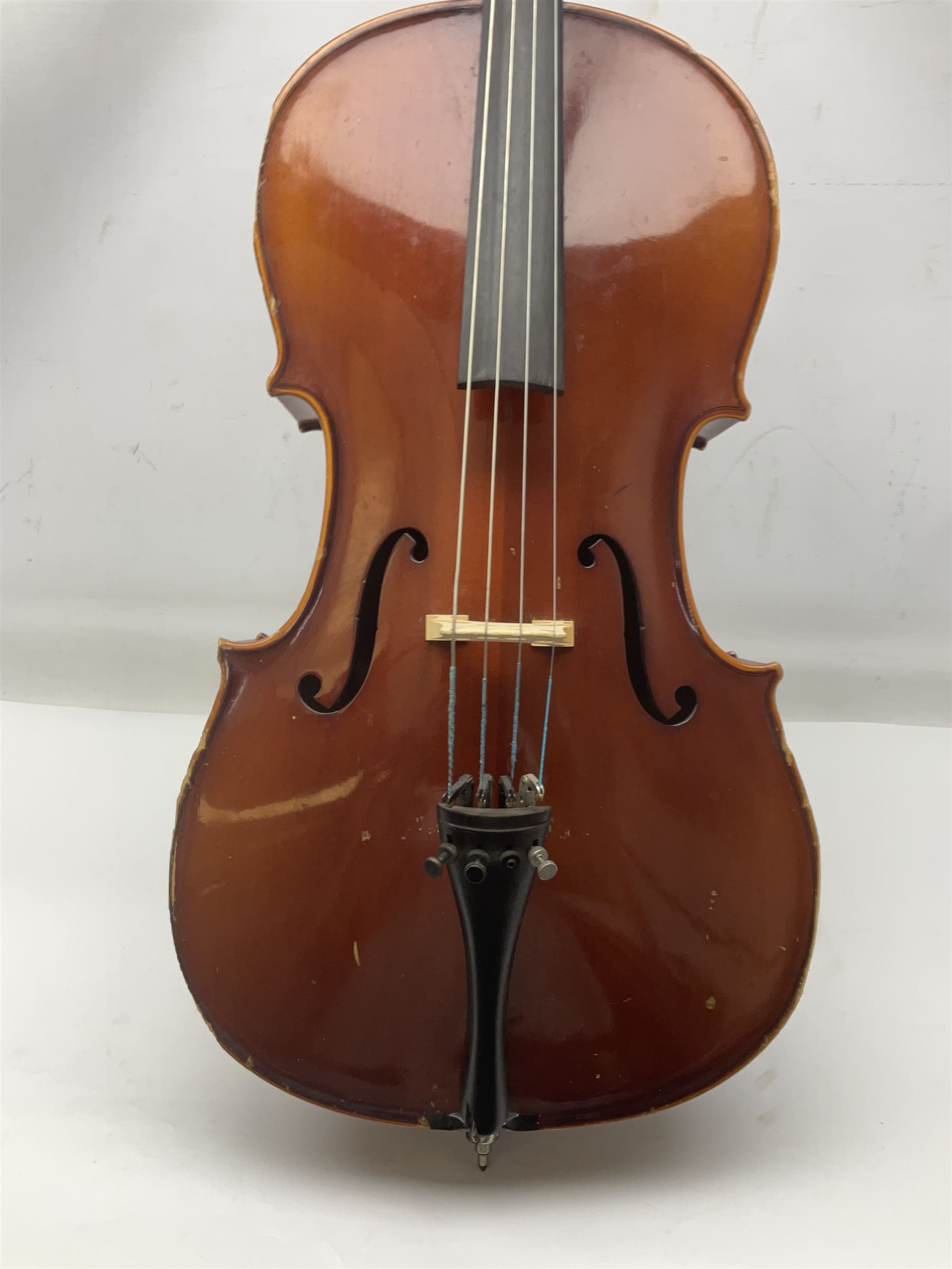 Two student half-size cellos - Boosey & Hawkes Artia with 65cm one-piece back and spruce top; bears maker's label; L104cm overall; and Romanian with 65.5cm two-piece maple back and ribs and spruce top; bears label; L108.5cm overall; each in soft carrying case with two bows (2)
