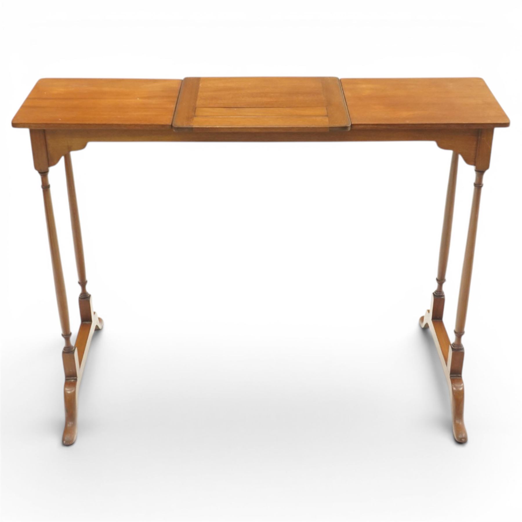 Edwardian mahogany reading stand, rectangular adjustable book rest with hinged ledge, flanked by rectangular side shelves, on slender turned twin end supports with splayed feet