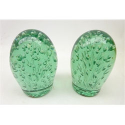  Two Victorian green glass dumpy weights each with multiple bubble inclusions, H13cm  
