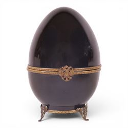 Limoges Fabergé  'Movie Camera' egg, the black and gilt hinged lid opening to reveal a gil...
