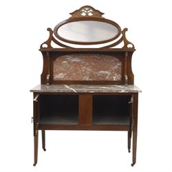 20th century mahogany marble topped washstand, rectangular veined grey marble top over two panelled cupboard doors with ring handles, raised on square tapering supports terminating in castors, the rear fitted with shaped back and oval swing mirror within a scroll cut frame surmounted by pierced cresting