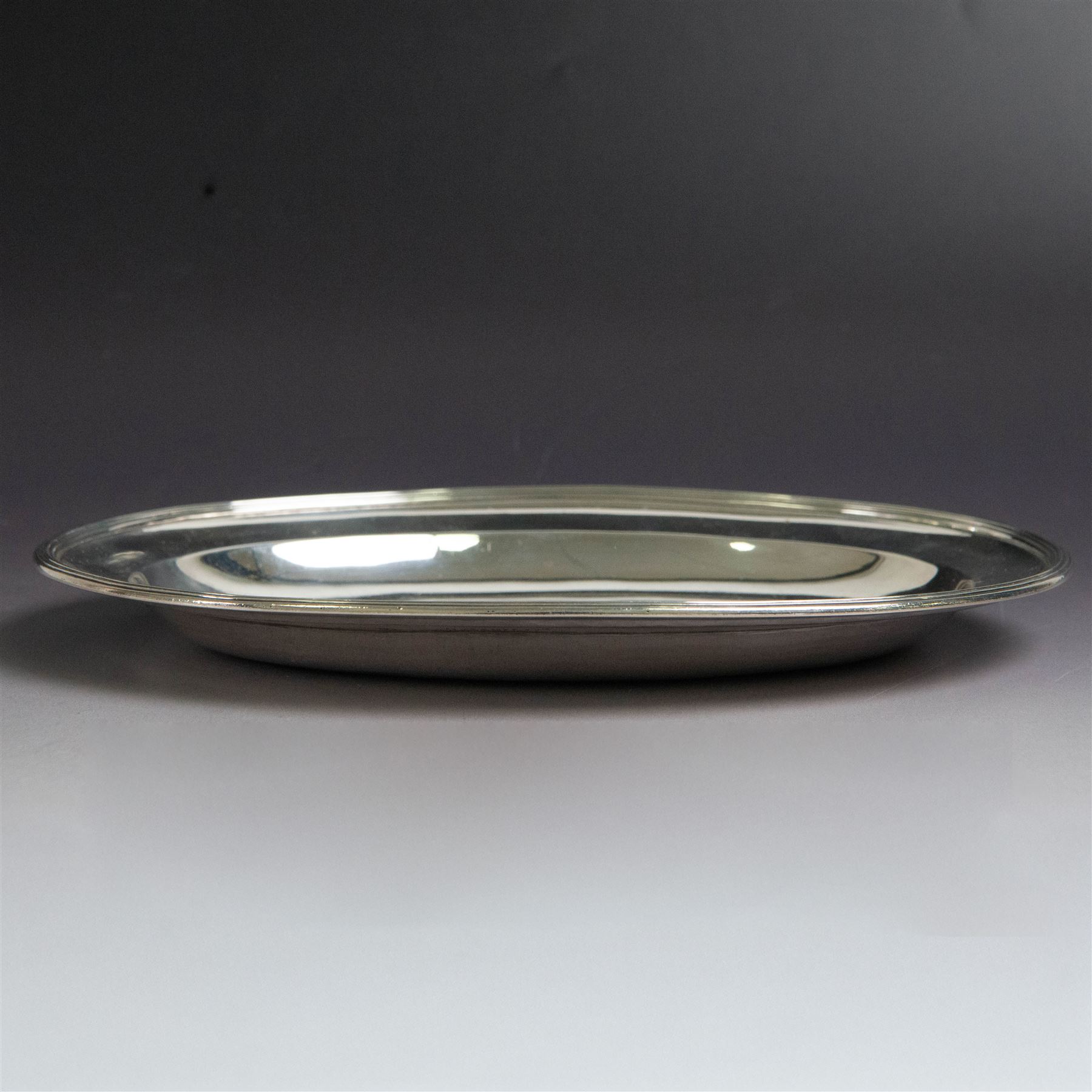 George III silver paten, of oval form, hallmarked Peter, Ann & William Bateman, London 1803, W21.5cm