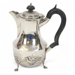 1920s silver hot water pot, with chased and repousse decoration to body depicting pheasants and rabbits in a countryside setting, with Bakelite type handle and finial, upon three palmette mounted feet, hallmarked S Blanckensee & Son Ltd, Birmingham 1928, H22cm