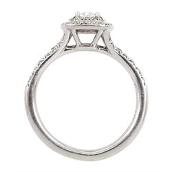Tiffany & Co platinum diamond cluster ring, principle cushion cut diamond 0.23 carat, with round brilliant cut diamond halo surround and diamond set shoulders, stamped PT950, with certificate