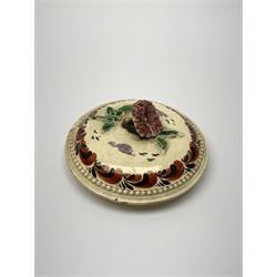 18th century creamware teapot, probably Leeds, with reeded entwined handle and floral finial to the cover, the body with hand painted polychrome decoration of figure to one side, and floral spray to the other, collectors paper label beneath inscribed Leeds Pottery, H11.5cm